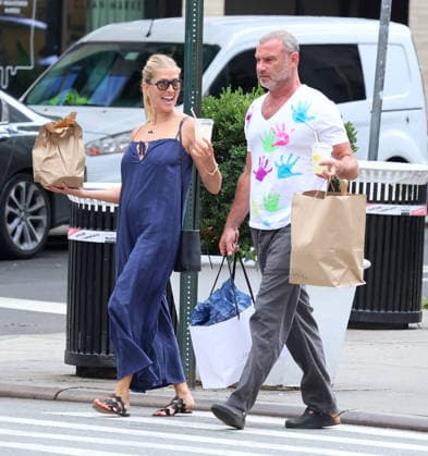 Liev Schreiber With His Wife Out in NYC Actor Liev Schreiber with a funny hand painted tshirt is walking with his wife Taylor Neisen in Soho, New York on August 18, 2026. Photo by Dylan Travis ABACAPRESS.COM New York City New York United States  Copyright: xDylanxTravis ABACAx