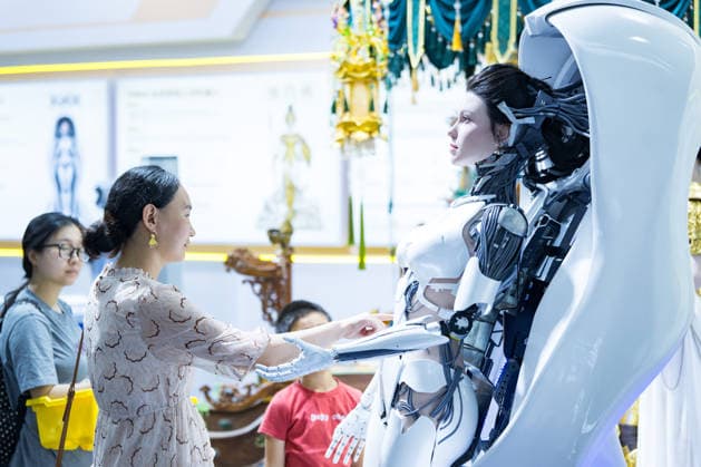 BEIJING, CHINA - AUGUST 19: A humanoid robot attracts visitors to touch and experience it during the opening of the 2026 World Robot Conference on August 19, 2026 in Beijing, China. The World Robot Conference 2026 kicks off in Beijing on August 19, bringing together leading robotics companies, experts and innovators from around the world. The event showcases the latest advances and applications across the robotics industry, from humanoid robots and embodied intelligence to cutting-edge components and real-world solutions.  Copyright: xChinaxNewsxServicex 111660848643