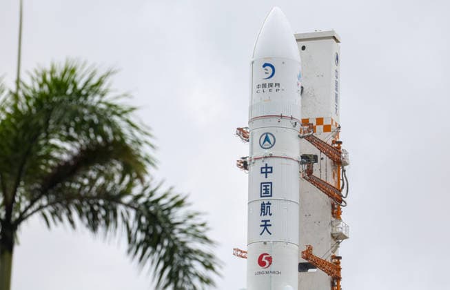 (260819) -- WENCHANG, Aug. 19, 2026 -- This photo taken on Aug. 19, 2026 shows the combination of the Chang e-7 lunar probe and the Long March-5 Y14 carrier rocket being transferred vertically to the launching area at the Wenchang Spacecraft Launch Site in south China s Hainan Province. The Chang e-7 lunar probe is scheduled for launch at an appropriate time, according to the China Manned Space Agency (CMSA). The combination of the Chang e-7 lunar probe and the Long March-5 Y14 carrier rocket was transferred vertically on Wednesday to the launching area at the Wenchang Spacecraft Launch Site in south China s Hainan Province, the CMSA said. The lunar probe and rocket had arrived at the launch site in April and July, respectively, and 