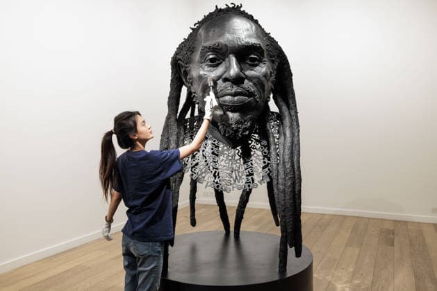 Benjamin Zephaniah sculpture Benjamin Zephaniah sculpture A sculpture of Benjamin Zephaniah by George Triggs is prepared for display at TM Gallery, London as part of a forthcoming exhibition opening 19 August to 30 September. Sculptor George Triggs who is dusting and polishing with bushes Along with Sculptor George Triggs who is dusting and polishing  Copyright: xVickixCouchmanx NINTCHDBPICT001101965406