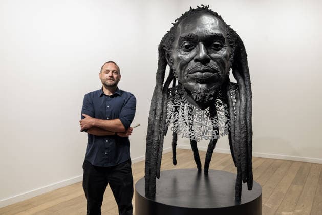 Benjamin Zephaniah sculpture Benjamin Zephaniah sculpture A sculpture of Benjamin Zephaniah by George Triggs is prepared for display at TM Gallery, London as part of a forthcoming exhibition opening 19 August to 30 September. Sculptor George Triggs who is dusting and polishing with bushes Along with Sculptor George Triggs who is dusting and polishing  Copyright: xVickixCouchmanx NINTCHDBPICT001101965414