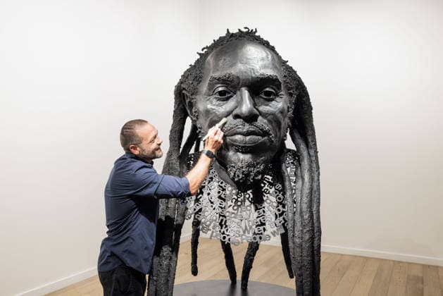 Benjamin Zephaniah sculpture Benjamin Zephaniah sculpture A sculpture of Benjamin Zephaniah by George Triggs is prepared for display at TM Gallery, London as part of a forthcoming exhibition opening 19 August to 30 September. Sculptor George Triggs who is dusting and polishing with bushes Along with Sculptor George Triggs who is dusting and polishing  Copyright: xVickixCouchmanx NINTCHDBPICT001101965456