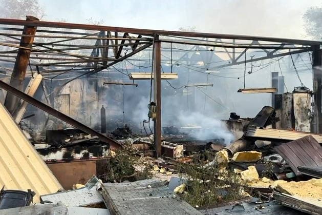 RUSSIA, LUGANSK - AUGUST 19, 2026: A storage shed burns down after a Ukrainian military strike, with a car repair shop and a confectionery factory inside. Video screen grab. Best quality available. Danil Derkayev TASS  96343808