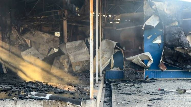 RUSSIA, LUGANSK - AUGUST 19, 2026: A storage shed burns down after a Ukrainian military strike, with a car repair shop and a confectionery factory inside. Video screen grab. Best quality available. Danil Derkayev TASS  96343858