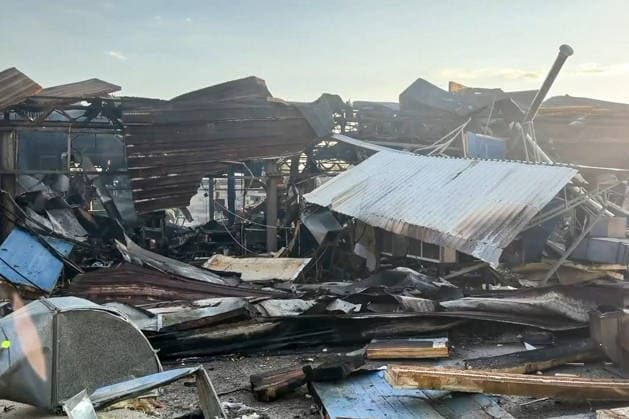 RUSSIA, LUGANSK - AUGUST 19, 2026: A storage shed burns down after a Ukrainian military strike, with a car repair shop and a confectionery factory inside. Video screen grab. Best quality available. Danil Derkayev TASS  96343859