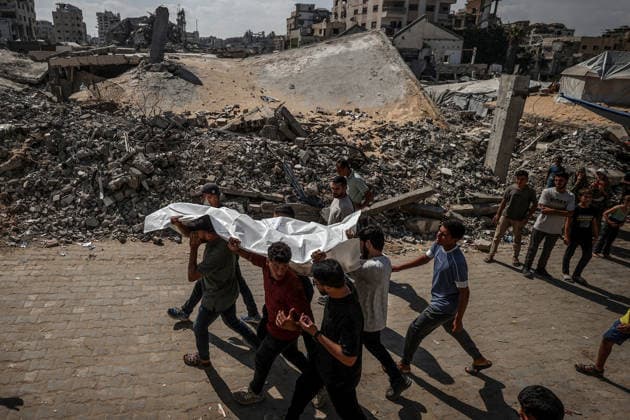 Funeral ceremony for those killed in an Israeli attack on a cafe in Gaza City GAZA CITY, GAZA, PALESTINE - AUGUST 19: Citizens and relatives of the Palestinians, killed in an Israeli drone strike targeting a beachfront cafe in the port area west of Gaza City, attend the funeral prayer at Al-Shifa Hospital in Gaza City, Gaza, Palestine on August 19, 2026. At least six Palestinians, including a child, were killed and more than 14 others injured when an Israeli unmanned aerial vehicle (UAV) fired missiles at the crowded cafe, despite calls from U.S. President Donald Trump for Israel to cease attacks in the enclave. Following the completion of funeral rites at the hospital, the victims were taken for burial by their mourning families. Ali Jadal  Copyright: x2026xAnadoluxAlixJadallahx
