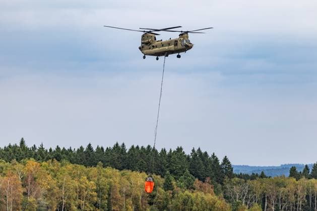 Chinook helicopter pictured on the site of the fire in the Hautes Fagnes (High Fens) nature reserve, on Wednesday 19 August 2026. The fire started on August 14th and 3000 hectares (on a total of 4500) are impacted.  BRUNOxFAHY 183773801