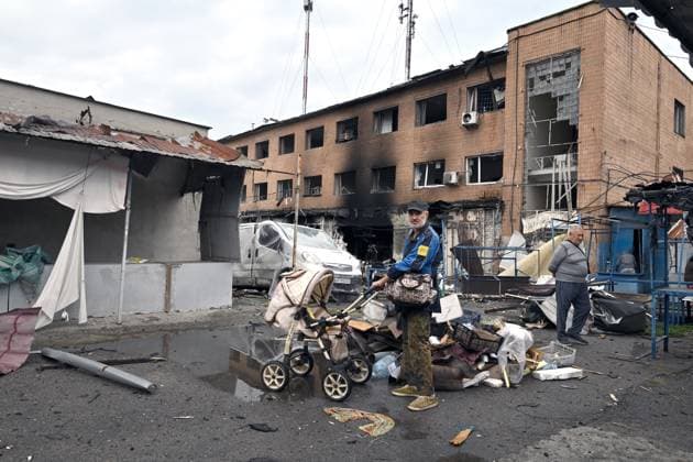 A man stands beside a stroller at the central market, damaged by a Russian attack, Zaporizhzhia, Ukraine, August 19, 2026. Overnight, the Russian army struck the south-eastern Ukrainian city with drones, destroying a hostel, a shopping centre, and the central market. (Photo by Dmytro Smolienko Ukrinform) Russian drones attack central market in Zaporizhzhia  Copyright: xDmytroxSmolienkox