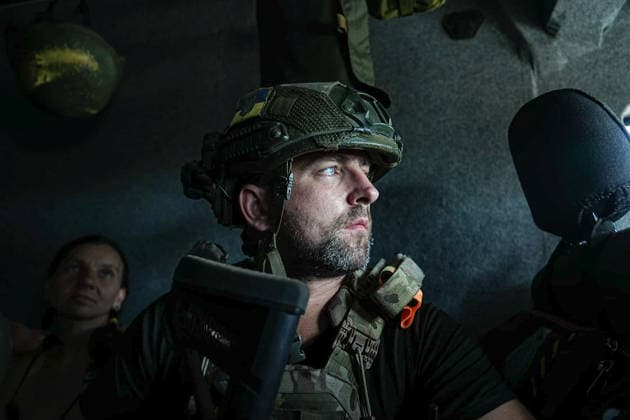 August 19, 2026, Serhiivka, Donetsk Oblast, Ukraine: Pavlo Diatchenko, from the White Angels crew, is sitting on a van after evacuating a family from the village of Serhiivka, east of Kramatorsk, in the Donbas region, Ukraine, on August 19, 2026. The White Angels crew, composed of police officers, evacuate people from the frontline towns and villages. Serhiivka Ukraine  - ZUMAa252 20260819_zip_a252_005 Copyright: xDavidxAllignonx