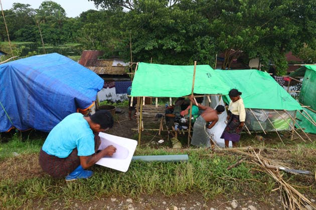 August 19, 2026, Ngathaingchaung, Ayeyarwady Division, Myanmar: Displaced residents in Ngathaingchaung Township, Ayeyarwady Region, build temporary shelters on a levee after homes were submerged by flooding..In Laymyethna Township, Ayeyarwady Region, the Ngawun River embankment collapsed on July 31, leaving nearby towns including Hinthada, Yegyi, Ngathaingchaung, Kyonpyaw and Kyaunggon still inundated, affecting tens of thousands of people, officials said. Ngathaingchaung Myanmar  - ZUMAn324 20260819_zip_n324_001 Copyright: xAyexMyaxNaingx