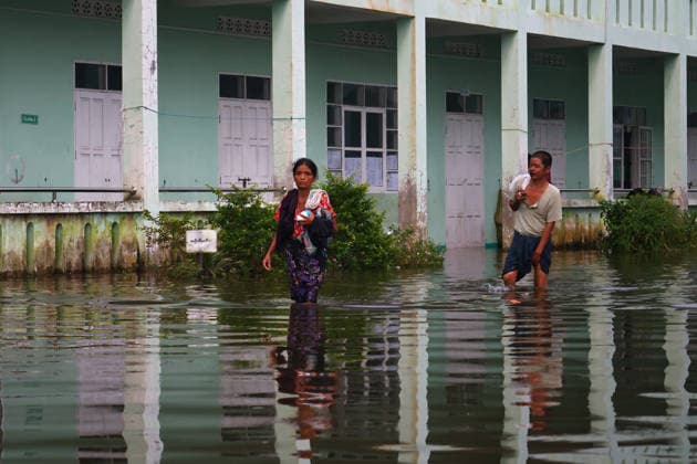August 19, 2026, Ngathaingchaung, Ayeyarwady Division, Myanmar: Homes are submerged by floodwaters in Ngathaingchaung Township, Ayeyarwady Region..In Laymyethna Township, Ayeyarwady Region, the Ngawun River embankment collapsed on July 31, leaving nearby towns including Hinthada, Yegyi, Ngathaingchaung, Kyonpyaw and Kyaunggon still inundated, affecting tens of thousands of people, officials said. Ngathaingchaung Myanmar  - ZUMAn324 20260819_zip_n324_007 Copyright: xAyexMyaxNaingx