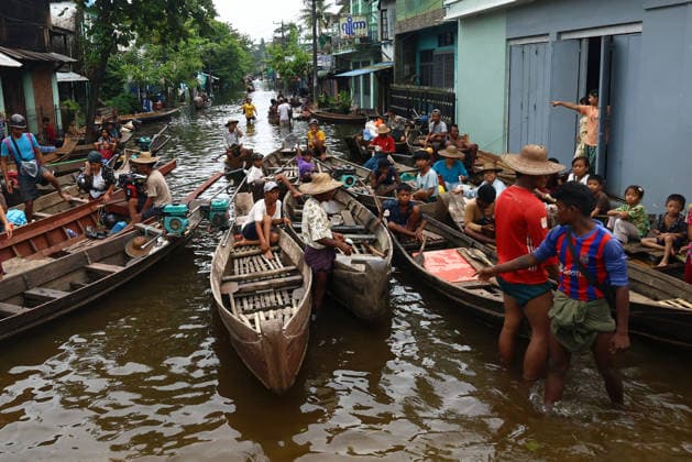 August 19, 2026, Ngathaingchaung, Ayeyarwady Division, Myanmar: People travel by boats through floodwaters in Ngathaingchaung Township, Ayeyarwady Region..In Laymyethna Township, Ayeyarwady Region, the Ngawun River embankment collapsed on July 31, leaving nearby towns including Hinthada, Yegyi, Ngathaingchaung, Kyonpyaw and Kyaunggon still inundated, affecting tens of thousands of people, officials said. Ngathaingchaung Myanmar  - ZUMAn324 20260819_zip_n324_034 Copyright: xAyexMyaxNaingx