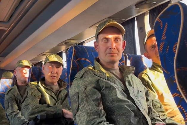 BELARUS - AUGUST 19, 2026: Russian servicemen released from Ukrainian captivity are seen on a bus. Video screen grab. Best quality available. Alexei Zhukov TASS  96358294