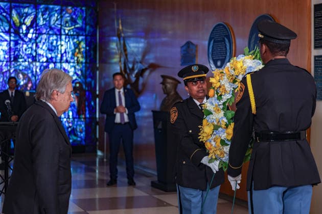 August 19, 2026, New York, New York, United States: United Nations Security Officers move a memorial wreath towards the original UN flag from the Canal Hotel in Baghdad as Secretary-General ANTONIO GUTERRES stands with his head bowed during an observance of World Humanitarian Day and the anniversary of the 19 August 2003 bombing of the UN headquarters in Baghdad, Iraq. New York United States - ZUMAo116 20260819_znp_o116_005 Copyright: xBiancaxOterox