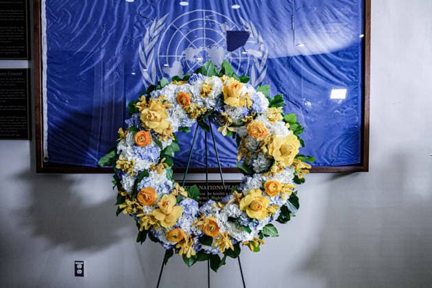 August 19, 2026, New York, New York, United States: A memorial wreath stands before the original UN flag from the Canal Hotel in Baghdad during an observance of World Humanitarian Day at UNHQ. The flag bears holes and tears sustained during the 19 August 2003 bombing of the UN headquarters in Baghdad, Iraq, which killed 22 people and injured more than 150 others. New York United States - ZUMAo116 20260819_znp_o116_008 Copyright: xBiancaxOterox