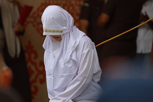 August 20, 2026, Banda Aceh, Aceh, Indonesia: A woman underwent a public caning in Taman Sari, Banda Aceh, Aceh Province, Indonesia, on Thursday, August 20, 2026. The Banda Aceh Sharia Court sentenced 11 people to between 7 and 100 lashes for violating Islamic Sharia. Banda Aceh Indonesia  - ZUMAs340 20260820_zip_s340_002 Copyright: xKhairuxSyukrillahx