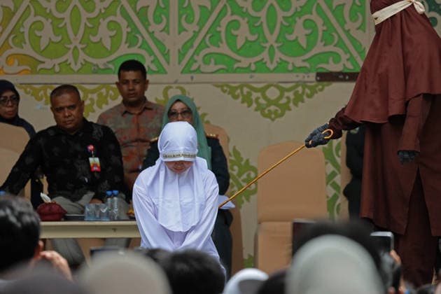 August 20, 2026, Banda Aceh, Aceh, Indonesia: A woman underwent a public caning in Taman Sari, Banda Aceh, Aceh Province, Indonesia, on Thursday, August 20, 2026. The Banda Aceh Sharia Court sentenced 11 people to between 7 and 100 lashes for violating Islamic Sharia. Banda Aceh Indonesia - ZUMAs340 20260820_zip_s340_005 Copyright: xKhairuxSyukrillahx