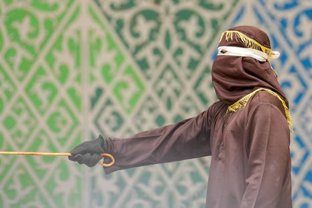 August 20, 2026, Banda Aceh, Aceh, Indonesia: An executioner carried out punishments on individuals who violated Sharia law at Bustanul Salatin Park in Banda Aceh, Aceh Province, Indonesia, on Thursday. Eleven people convicted of violating the *Qanun Jinayat* (Islamic Criminal Code) underwent the *uqubat* (punishment) of public caning. Among the eleven convicts, four were found guilty of *zina* (illicit sexual relations) and were each sentenced to receive 100 lashes. Banda Aceh Indonesia  - ZUMAi115 20260820_zip_i115_032 Copyright: xMuhammadxIqbalx