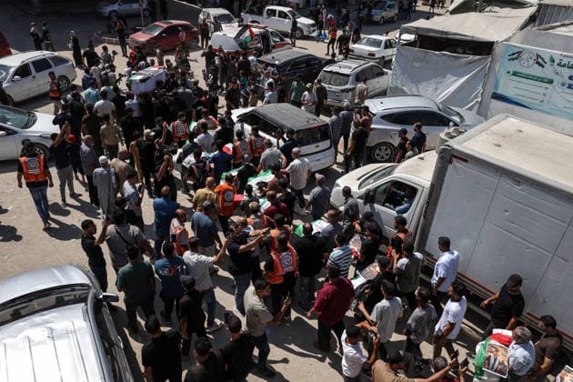 Funeral held for 50 Palestinians recovered from rubble at Al-Shifa Hospital in Gaza GAZA CITY, GAZA, PALESTINE - AUGUST 20: Relatives and local residents attend the funeral ceremony for 50 Palestinians, whose bodies were recovered from the rubble of buildings destroyed in intense Israeli bombardments, at the courtyard of Al-Shifa Medical Complex in Gaza City, Gaza, Palestine on August 20, 2026. Following extensive search and rescue operations by Palestinian Civil Defense teams, the recovered bodies were brought to the medical complex before being laid to rest by grieving families and community members. Ali Jadallah Anadolu Gaza City Gaza. Editorial use only. Please get in touch for any other usage.  Copyright: x2026xAnadoluxAlixJadallahx