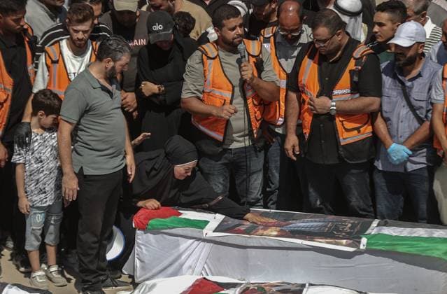 Funeral held for 50 Palestinians recovered from rubble at Al-Shifa Hospital in Gaza GAZA CITY, GAZA, PALESTINE - AUGUST 20: Relatives and local residents attend the funeral ceremony for 50 Palestinians, whose bodies were recovered from the rubble of buildings destroyed in intense Israeli bombardments, at the courtyard of Al-Shifa Medical Complex in Gaza City, Gaza, Palestine on August 20, 2026. Following extensive search and rescue operations by Palestinian Civil Defense teams, the recovered bodies were brought to the medical complex before being laid to rest by grieving families and community members. Ali Jadallah Anadolu Gaza City Gaza. Editorial use only. Please get in touch for any other usage.  Copyright: x2026xAnadoluxAlixJadallahx
