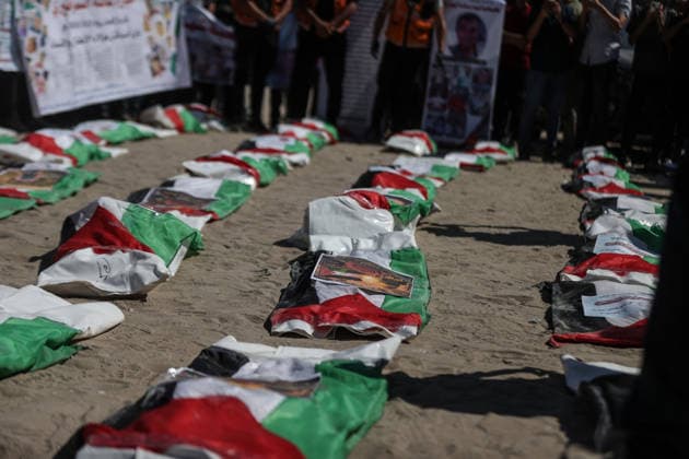 Funeral held for 50 Palestinians recovered from rubble at Al-Shifa Hospital in Gaza GAZA CITY, GAZA, PALESTINE - AUGUST 20: Relatives and local residents attend the funeral ceremony for 50 Palestinians, whose bodies were recovered from the rubble of buildings destroyed in intense Israeli bombardments, at the courtyard of Al-Shifa Medical Complex in Gaza City, Gaza, Palestine on August 20, 2026. Following extensive search and rescue operations by Palestinian Civil Defense teams, the recovered bodies were brought to the medical complex before being laid to rest by grieving families and community members. Ali Jadallah Anadolu Gaza City Gaza. Editorial use only. Please get in touch for any other usage.  Copyright: x2026xAnadoluxAlixJadallahx