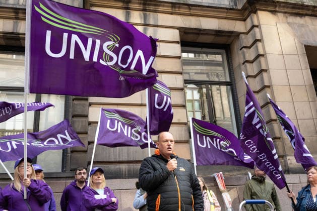 August 20, 2026, Glasgow, Scotland, UK: Members of the Unite, UNISON and GMB unions held a protest outside Glasgow City Chambers to coincide with a vote on a new pay and grading scheme for council employees. The unions claim the councils proposals would adversely affect low-paid workers, particularly women, who they say have been underpaid for two decades. Glasgow UK - ZUMAs357 20260820_zip_s357_008 Copyright: xCameronxScottx