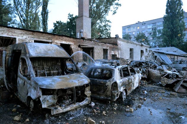Burnt-out civilian cars are outside an apartment block in the Solomianskyi district after a Russian missile attack, Kyiv, Ukraine, August 20, 2026. High-rise residential buildings, a children’s hospital, a school, utility and warehouse facilities, garages, and cars were damaged in the district as a result of Russia’s overnight large-scale combined strike on the capital. Power grid infrastructure was also affected, causing an outage. In Kyiv, the attack claimed the lives of at least 13 people, including two children. The Russian military targeted the city with ballistic missiles, Kalibr cruise missiles, Kh-101s, and Zircon hypersonic cruise missiles. (Photo by Oleksandr Klymenko Ukrinform) Aftermath of Russian strike in Solomianskyi district  Copyright: xOleksandrxKlymenkox