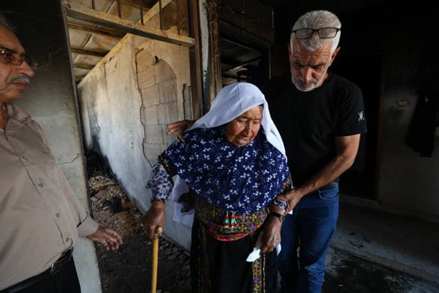Palestinians Inspect Fire-Damaged Home South of Hebron Palestinians inspect a house damaged by fire that residents said was set by Israeli settlers in the Khallat al-Farra area of Yatta, south of Hebron, in the West Bank, on August 20, 2026. Photo by Mamoun Wazwaz apaimages Hebron West Bank Palestinian Territory 200826_Hebron_MW_01(7) Copyright: xapaimagesxMamounxWazwazx xapaimagesx