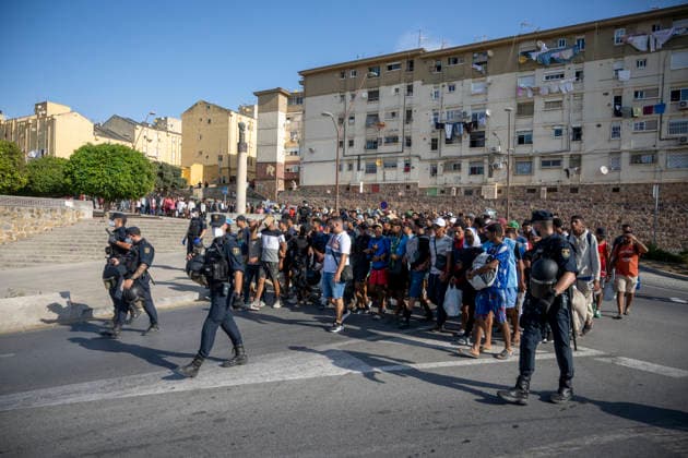 Police Clear Trampolín Beach in Ceuta Migrants cleared from Trampolín Beach are on their way to be relocated, August 20, 2026, in Ceuta, Spain. Police have begun to clear the makeshift migrant camp on Trampolín Beach in Ceuta. The autonomous city continues to face a serious humanitarian crisis following the historic mass influx of more than 70,000 migrants who swam across the Tarajal Strait on 30th and 31st of last July 20 AUGUST 2026 Ceuta Ceuta, Spain  Copyright: xMarcosxMorenox 7722742