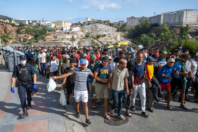 Police Clear Trampolín Beach in Ceuta Migrants cleared from Trampolín Beach on their way to be relocated, August 20, 2026, in Ceuta, Spain. Police have begun to clear the makeshift migrant camp on Trampolín Beach in Ceuta. The autonomous city continues to face a serious humanitarian crisis following the historic mass influx of more than 70,000 migrants who swam across the Tarajal Strait on 30 and 31 of last July 20 AUGUST 2026 Ceuta Ceuta, Spain  Copyright: xMarcosxMorenox 7722749