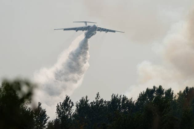 August 20, 2026, Grebenac, Vojvodina, Serbia: 2026820, Grebenac, Serbia - An Ilyushin Il-76 aircraft belonging to the Russian Ministry of Emergency Situations (EMERCOM) drops water over a massive wildfire in the Deliblato Sands (Deliblatska Pescara) Special Nature Reserve. The Russian water bomber was deployed to assist Serbian emergency services in battling the blaze in the strictly protected natural area, often referred to as the European Sahara. Grebenac Serbia  - ZUMAd223 20260820_zip_d223_004 Copyright: xMarkoxDimicx