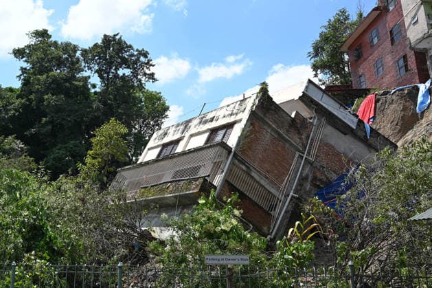 House Collapses after rainfall in Nepal s Kathmandu KATHMANDU, NEPAL - AUGUST 21: A two-and-a-half-storey house, operating as the New Gandaki Guest House, sinks into the ground after heavy rainfall destabilized the foundation in the Bansbari area of Kathmandu, Nepal, on August 21, 2026. No casualties were reported as the occupants had vacated the premises prior to the collapse. Local authorities issued precautions for nearby residential structures at risk due to continuous precipitation and ground subsidence. Safal Prakash Shrestha Anadolu Kathmandu Nepal. Editorial use only. Please get in touch for any other usage.  Copyright: x2026xAnadoluxSafalxPrakashxShresthax