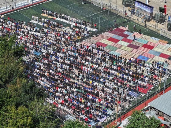 TEKNOFEST Blue Homeland KOCAELI, TURKIYE - AUGUST 21: An aerial view shows people performing Friday prayers on a football pitch during TEKNOFEST Blue Homeland at the Golcuk Naval Shipyard Command in Kocaeli, Turkiye, on August 21, 2026. Organized under the main leadership of the Turkish National Defense Ministry and the Turkish Technology Team Foundation (T3 Foundation), with Anadolu as the Global Communication Partner, the event showcases Turkiye s maritime power, defense capabilities, and indigenous technologies. Gathering technology and defense industry enthusiasts around a maritime focus, the festival will welcome visitors through August 23. Cem Tekkesinoglu Anadolu Kocaeli Turkey. Editorial use only. Please get in touch for any other  Copyright: x2026xAnadoluxCemxTekkesinoglux
