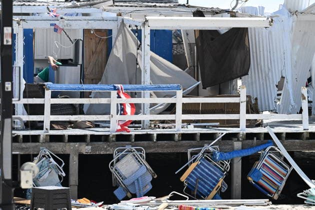 Tornado damage at Atlantic Beach in Long Island, New York NEW YORK, UNITED STATES - AUGUST 21: Emergency personnel and cleanup crews work amidst debris at the Sun and Surf Beach Club in Atlantic Beach, Long Island, New York, United States on August 21, 2026, following a rare tornado touchdown. The storm made landfall at approximately 7:11 p.m. on Thursday evening as a waterspout before moving ashore, destroying roughly 50 cabanas and tearing off roofs across the facility while nearly 100 people were present. Nassau County declared a state of emergency overnight as search teams swept the property, reporting only one minor injury, while the National Weather Service officially confirmed the tornadic event on Friday morning Kyle Mazza Anadolu  Copyright: x2026xAnadoluxKylexMazzax