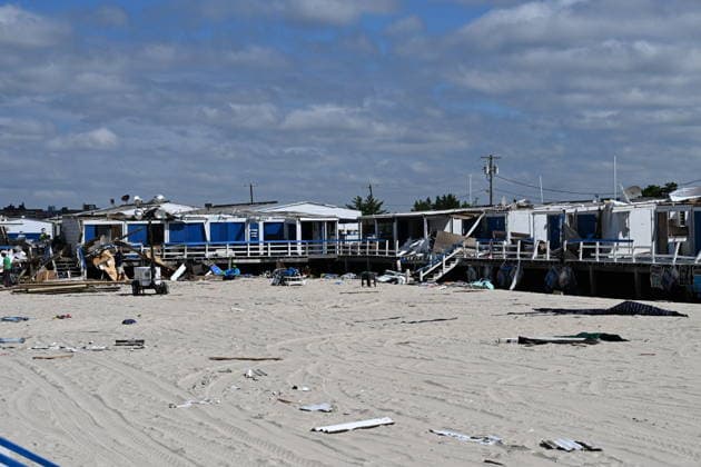 Tornado damage at Atlantic Beach in Long Island, New York NEW YORK, UNITED STATES - AUGUST 21: Emergency personnel and cleanup crews work amidst debris at the Sun and Surf Beach Club in Atlantic Beach, Long Island, New York, United States on August 21, 2026, following a rare tornado touchdown. The storm made landfall at approximately 7:11 p.m. on Thursday evening as a waterspout before moving ashore, destroying roughly 50 cabanas and tearing off roofs across the facility while nearly 100 people were present. Nassau County declared a state of emergency overnight as search teams swept the property, reporting only one minor injury, while the National Weather Service officially confirmed the tornadic event on Friday morning Kyle Mazza Anadolu  Copyright: x2026xAnadoluxKylexMazzax