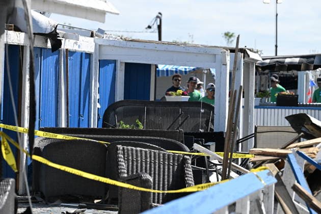 Tornado damage at Atlantic Beach in Long Island, New York NEW YORK, UNITED STATES - AUGUST 21: Emergency personnel and cleanup crews work amidst debris at the Sun and Surf Beach Club in Atlantic Beach, Long Island, New York, United States on August 21, 2026, following a rare tornado touchdown. The storm made landfall at approximately 7:11 p.m. on Thursday evening as a waterspout before moving ashore, destroying roughly 50 cabanas and tearing off roofs across the facility while nearly 100 people were present. Nassau County declared a state of emergency overnight as search teams swept the property, reporting only one minor injury, while the National Weather Service officially confirmed the tornadic event on Friday morning Kyle Mazza Anadolu  Copyright: x2026xAnadoluxKylexMazzax