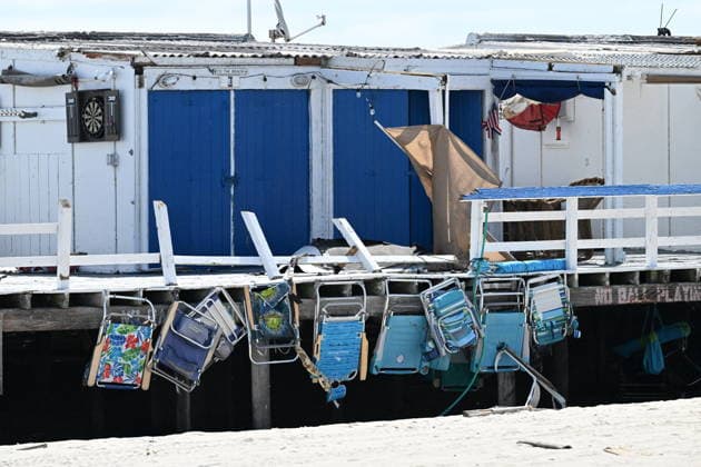 Tornado damage at Atlantic Beach in Long Island, New York NEW YORK, UNITED STATES - AUGUST 21: Emergency personnel and cleanup crews work amidst debris at the Sun and Surf Beach Club in Atlantic Beach, Long Island, New York, United States on August 21, 2026, following a rare tornado touchdown. The storm made landfall at approximately 7:11 p.m. on Thursday evening as a waterspout before moving ashore, destroying roughly 50 cabanas and tearing off roofs across the facility while nearly 100 people were present. Nassau County declared a state of emergency overnight as search teams swept the property, reporting only one minor injury, while the National Weather Service officially confirmed the tornadic event on Friday morning Kyle Mazza Anadolu  Copyright: x2026xAnadoluxKylexMazzax