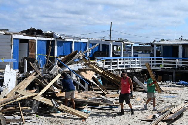 Tornado damage at Atlantic Beach in Long Island, New York NEW YORK, UNITED STATES - AUGUST 21: Emergency personnel and cleanup crews work amidst debris at the Sun and Surf Beach Club in Atlantic Beach, Long Island, New York, United States on August 21, 2026, following a rare tornado touchdown. The storm made landfall at approximately 7:11 p.m. on Thursday evening as a waterspout before moving ashore, destroying roughly 50 cabanas and tearing off roofs across the facility while nearly 100 people were present. Nassau County declared a state of emergency overnight as search teams swept the property, reporting only one minor injury, while the National Weather Service officially confirmed the tornadic event on Friday morning Kyle Mazza Anadolu  Copyright: x2026xAnadoluxKylexMazzax
