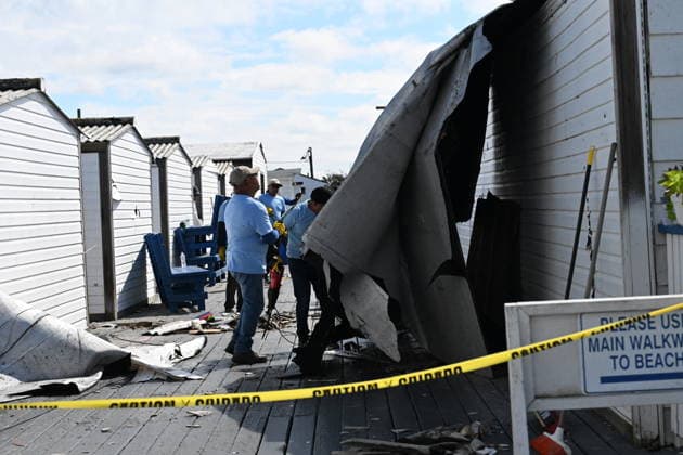 Tornado damage at Atlantic Beach in Long Island, New York NEW YORK, UNITED STATES - AUGUST 21: Emergency personnel and cleanup crews work amidst debris at the Sun and Surf Beach Club in Atlantic Beach, Long Island, New York, United States on August 21, 2026, following a rare tornado touchdown. The storm made landfall at approximately 7:11 p.m. on Thursday evening as a waterspout before moving ashore, destroying roughly 50 cabanas and tearing off roofs across the facility while nearly 100 people were present. Nassau County declared a state of emergency overnight as search teams swept the property, reporting only one minor injury, while the National Weather Service officially confirmed the tornadic event on Friday morning Kyle Mazza Anadolu  Copyright: x2026xAnadoluxKylexMazzax