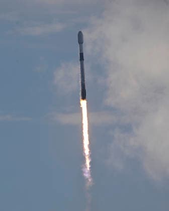 As viewed from the Complex 39 viewing site, SpaceX launches the Falcon 9 rocket carrying an additional 29 Starlink satellites on mission 10-39 at at 11:14 AM from Launch Complex 40 at the Cape Canaveral Space Force Station, Florida on Friday August 21, 2026.  CCP20260821005 JOExMARINO