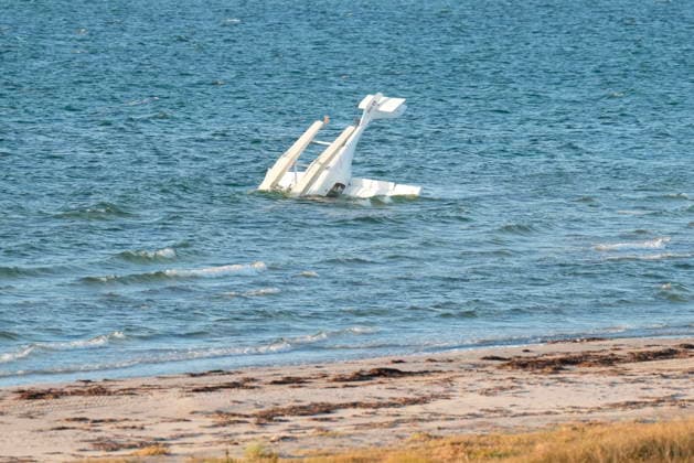 Plane is upside down - two people on board Small plane is seen 20 meters out in the water at the beach near Storedal off the Island of Laesoe, Denmark, Friday August 21, 2026. North Jutland Emergency Services tells that a Swedish man and a Norwegian man were on board, and both are unharmed and currently staying at a hotel. , Laesoe Denmark *** The plane is upside down with two people on board. The small plane was spotted 20 meters out in the water at the beach near Storedal off the island of Laesø, Denmark, on Friday, August 21, 2026. North Jutland Emergency Services reports that a Swedish man and a Norwegian man were on board; both are unharmed and are currently staying at a hotel in Laesoe, Denmark.  Copyright: ClausxFiskerx spdk20260821-195028-L