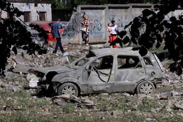 RECORD DATE NOT STATED A civilian car destroyed in a massive Russian missile attack near a sports ground by a school in Kyiv’s Solomianskyi district, Ukraine, on August 20, 2026. Eight people were killed in the district as a result of Russia’s overnight massive combined attack. At least 16 multi-storey residential buildings were damaged, including a nine-storey building whose upper floors were destroyed, as well as a school, a kindergarten and premises of a children’s hospital. State Emergency Service rescuers and municipal workers are dismantling hazardous structures and clearing debris at the impact sites. An emergency assistance centre has been set up for those affected (Photo by Pavlo Bahmut Ukrinform) Aftermath of Russian strike in Solomianskyi district of K  Copyright: xPavloxBahmutx