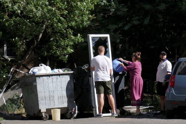 RECORD DATE NOT STATED Local residents clean up the aftermath of an overnight Russian attack in Kyiv’s Solomianskyi district, Ukraine, on August 20, 2026. Eight people were killed in the district as a result of Russia’s overnight massive combined attack. At least 16 multi-storey residential buildings were damaged, including a nine-storey building whose upper floors were destroyed, as well as a school, a kindergarten and premises of a children’s hospital. State Emergency Service rescuers and municipal workers are dismantling hazardous structures and clearing debris at the impact sites. An emergency assistance centre has been set up for those affected (Photo by Pavlo Bahmut Ukrinform) Aftermath of Russian strike in Solomianskyi district of Kyiv  Copyright: xPavloxBahmutx