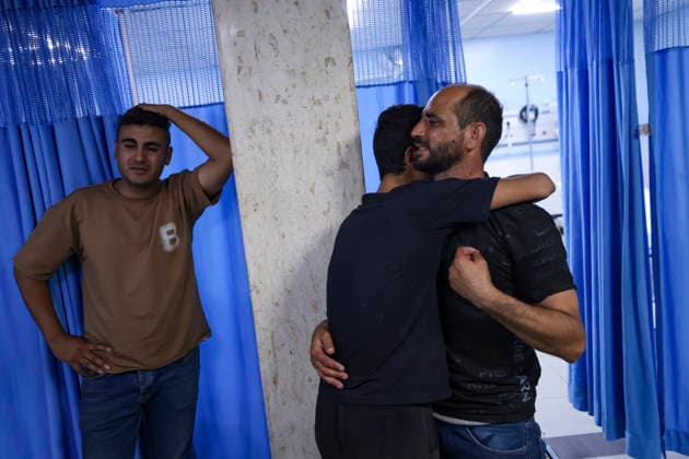 Farewell for 17 Year Old Karim Al Shalaldeh Two Palestinian men embrace as other mourners stand nearby during the funeral of 17-year-old Karim Sanad Shalaldeh in Sa ir, northeast of Hebron, in the occupied West Bank, on August 21, 2026. The Palestinian Health Ministry said Shalaldeh was killed by Israeli settler gunfire during an attack in the Khirbet Hamroush area of Sa ir that also wounded a 70-year-old Palestinian man; local reports said settlers set fire to a home, while the Israeli military said a security official opened fire after Palestinians threw stones at Israelis who were in the area without prior authorization. Hebron West Bank Palestinian Territories Copyright: xMosabxShawerx