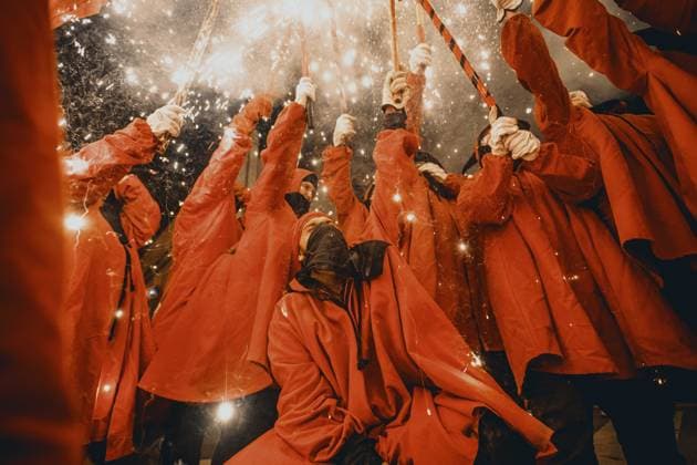 August 21, 2026, Barcelona, Catalonia, Spain: Fire runners gather to ignite their firework staffs beneath a shower of sparks during the traditional Ã¢â‚¬ËœCorrefocÃ¢â‚¬â ¢ at the Festa Major de Gracia Barcelona Spain - ZUMAo105 20260821_fap_o105_011 Copyright: xMatthiasxOesterlex
