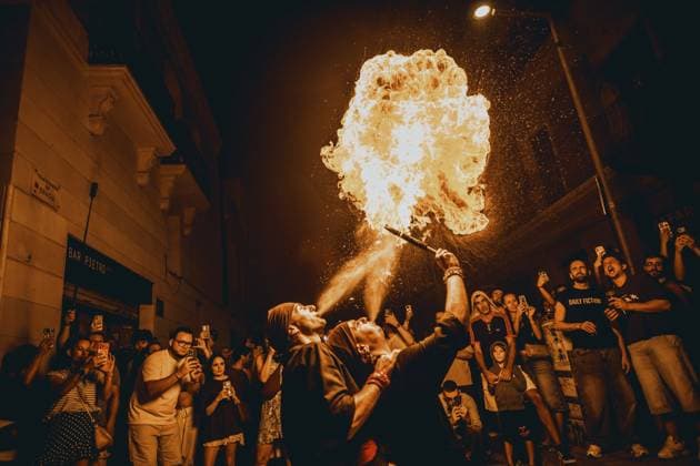 August 21, 2026, Barcelona, Catalonia, Spain: Two fire breathers blow a plume of fire during the traditional Ã¢â‚¬ËœCorrefocÃ¢â‚¬â ¢ at the Festa Major de Gracia Barcelona Spain - ZUMAo105 20260821_fap_o105_029 Copyright: xMatthiasxOesterlex