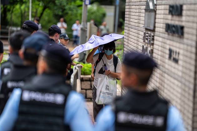 Hong Kong Court Verdit on Tiananmen Vigil Organizers Police officers standing guard outside the West Kowloon Magistrates Courts before the court hands down the verdict on the Tiananmen Vigil Organizers on August 20, 2026 in Hong Kong. A Hong Kong court today founded the organizers of the previous annual Tiananmen Vigil in Victoria Park guilty of inciting subversion. (Photo by Vernon Yuen Nexpher Images) HONG KONG