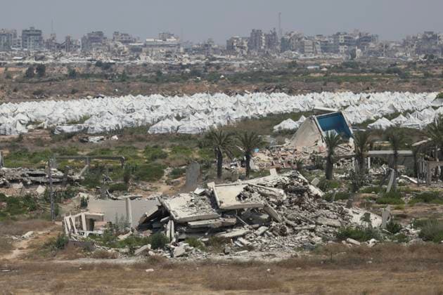 General View Shows War Damage in al-Mughraqa A general view shows the scale of destruction in residential areas in the al-Mughraqa area of the central Gaza Strip on August 22, 2026, as Palestinians move between the rubble of buildings destroyed during the war. Rubble and parts of collapsed buildings line both sides of the road, highlighting the widespread damage to the urban landscape and the daily life of residents. Photo by Hassan al-Jedi apaimages Nusairat Gaza Strip Palestinian Territory 220826_Mughraqa_HJ_00(15).jpeg Copyright: xapaimagesxHassanxal-Jedixx xapaimagesx