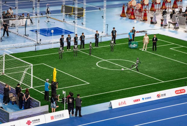 (260822) -- BEIJING, Aug. 22, 2026 -- Humanoid robots play football during the opening ceremony of the 2nd World Humanoid Robot Games in Beijing, capital of China, Aug. 22, 2026. ) (SP)CHINA-BEIJING-WORLD HUMANOID ROBOT GAMES-OPENING CEREMONY (CN) SunxFei 