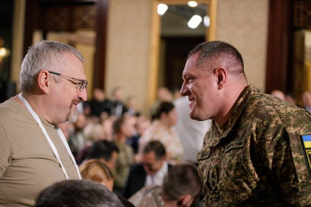Commander of the National Guard of Ukraine, Major General Oleksandr Pivnenko (R) attends the Ninth International Veterans Forum, Kyiv, Ukraine, August 22, 2026. Hundreds of veterans, representatives of the Ukrainian government, foreign partners, and distinguished guests took part in the large-scale annual event, which serves as Ukraine’s principal platform for dialogue on the development and implementation of state veterans’ policy. (Photo by Marianna Kotyk Ukrinform) Ninth International Veterans Forum in Kyiv  Copyright: xMariannaxKotykx
